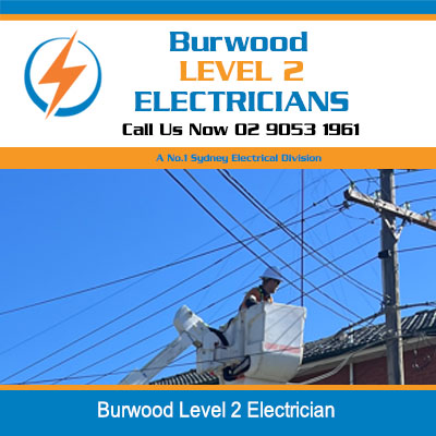 Level 2 electrician working with elevated boom lift positioned for overhead power line work in Burwood